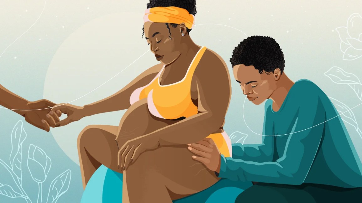 Black mother supported by a doula and her partner