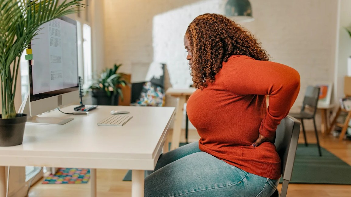 obese woman sitting at a desk